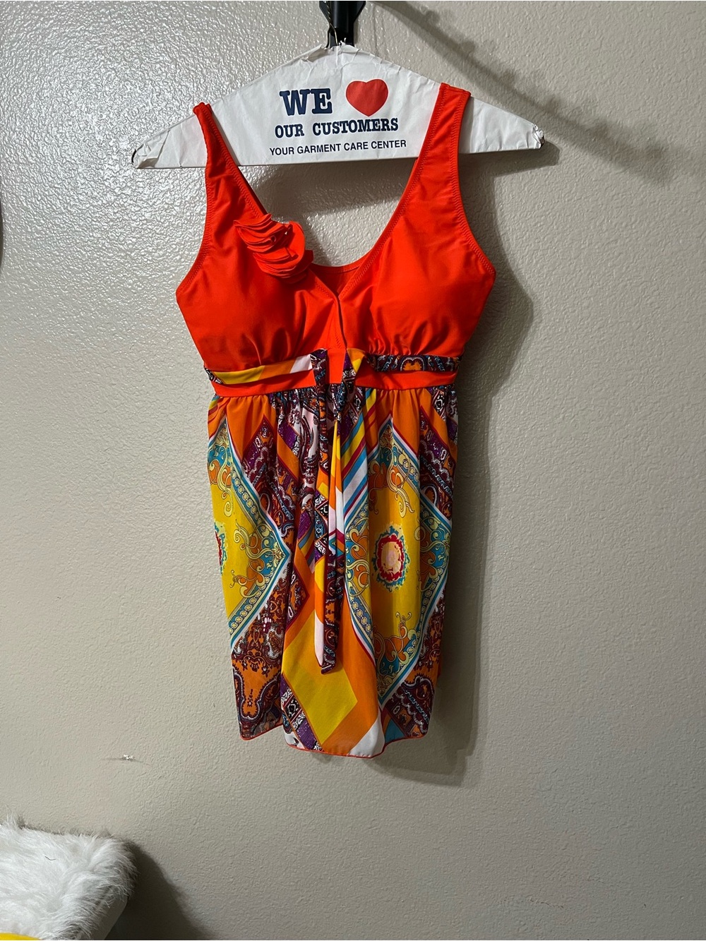 Vibrant Orange Mixed-Print bathing suit.